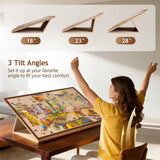 Close-up of the 3-angle adjustable felt puzzle board tilted on a stand, showing non-slip fabric holding jigsaw pieces in place.